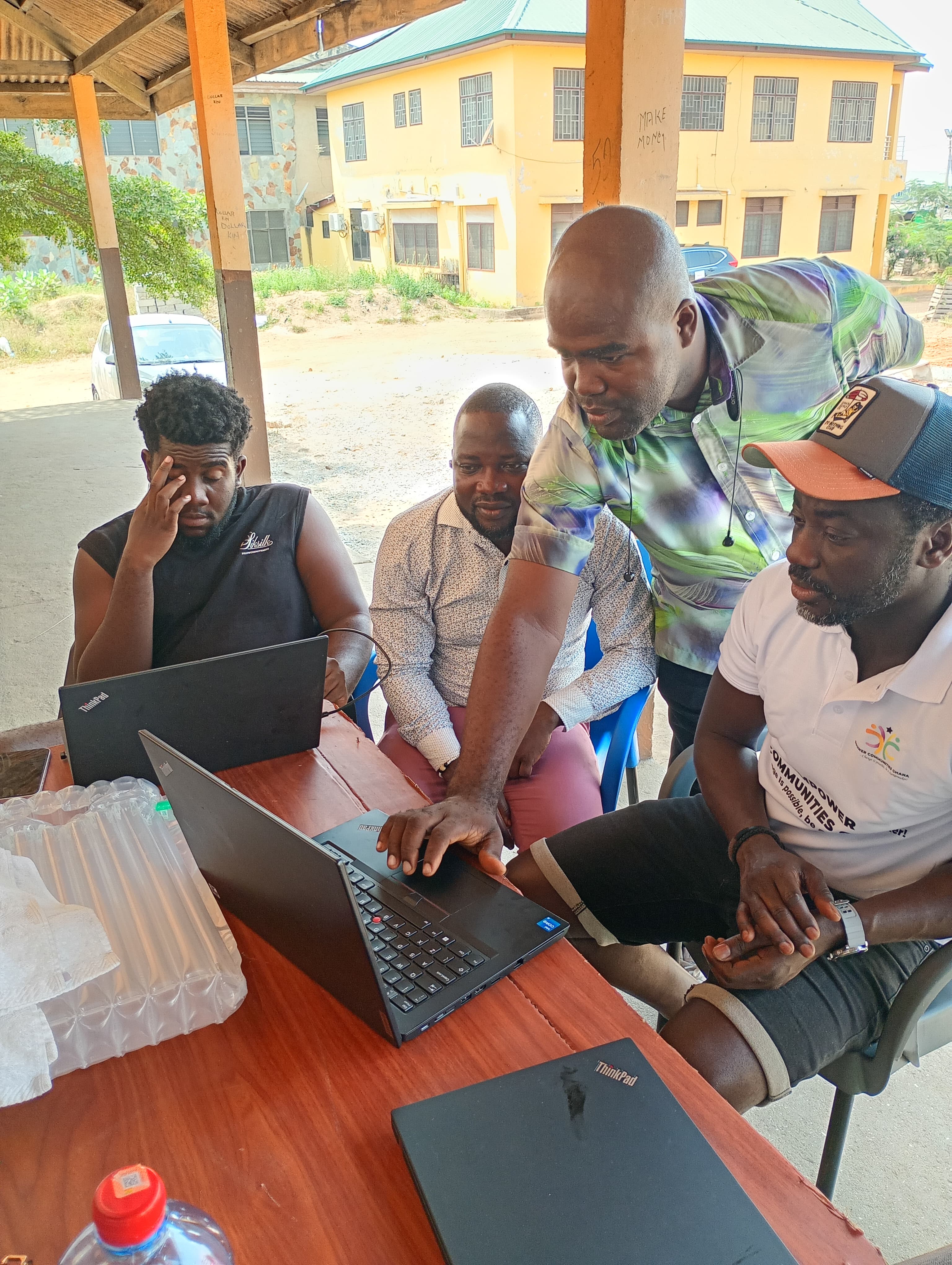 Children learning with computers through Empower Communities Ghana programmes