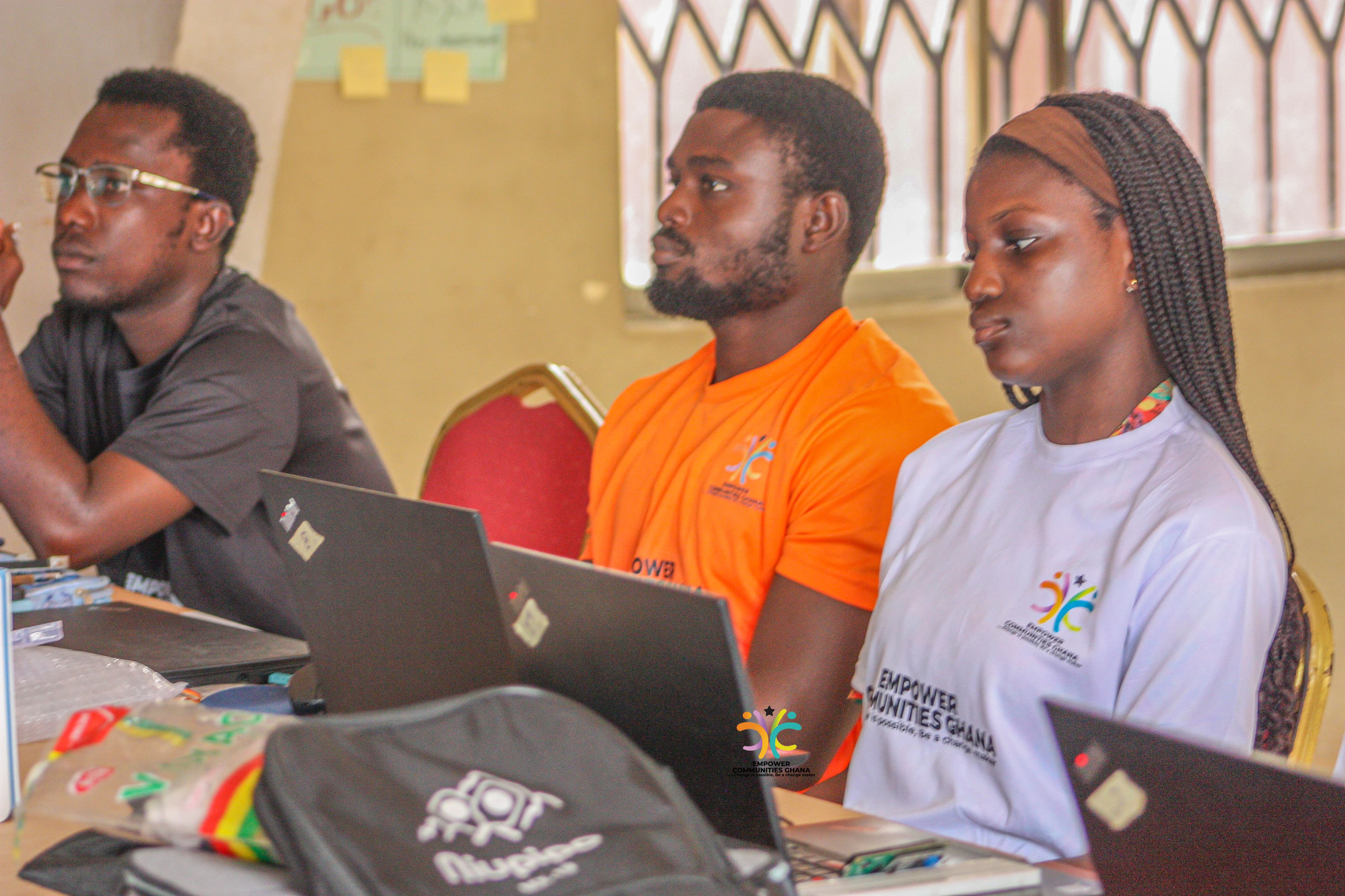 Children learning with computers through Empower Communities Ghana programmes